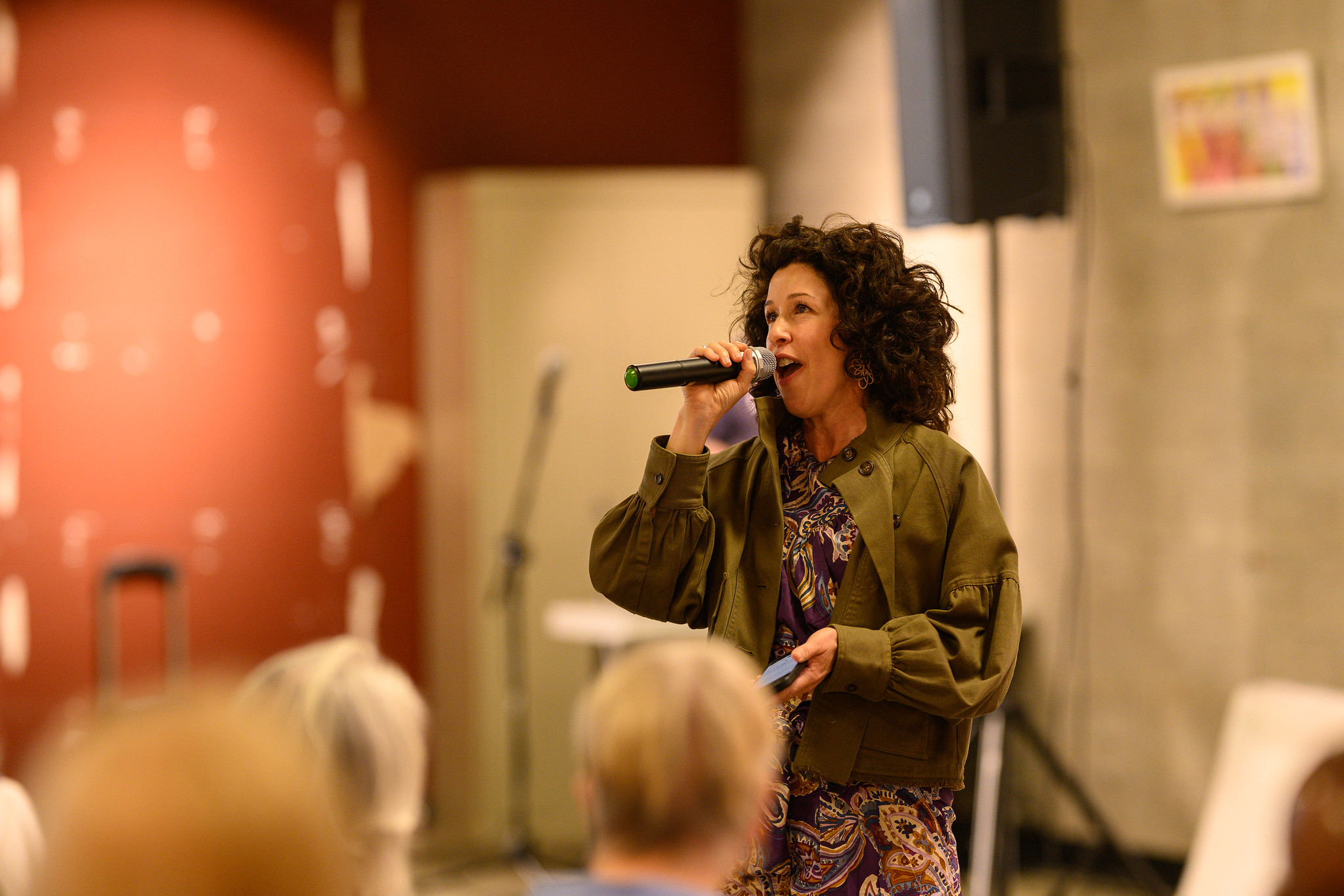 Nova Jimenez singing into a microphone