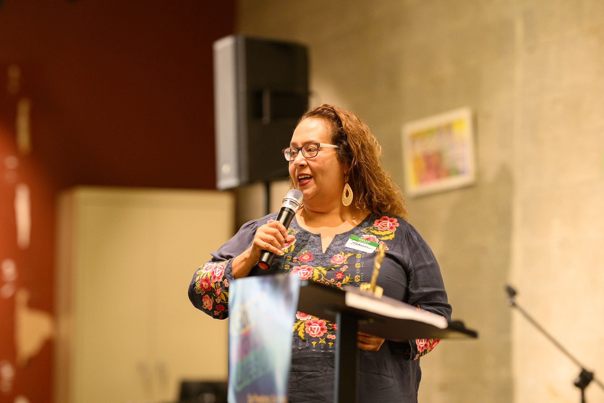 Rebeca Armendariz speaking at a lectern